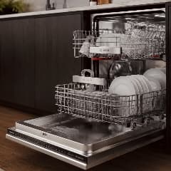 Dishwasher Repair — open dishwasher with loaded racks