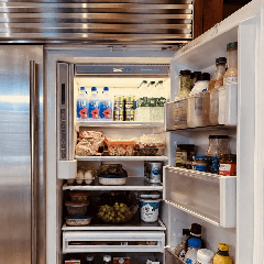 Refrigerator Repair — open stainless steel refrigerator