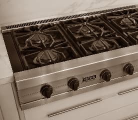 Stove Repair — gas cooktop with cast iron grates