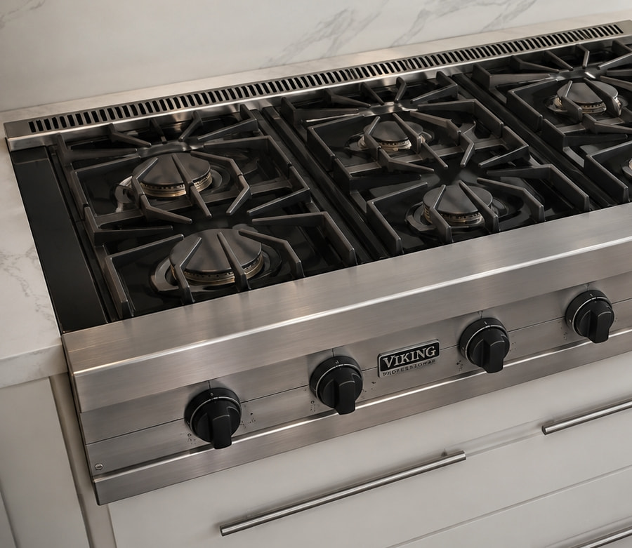 Stainless steel gas cooktop with cast iron grates